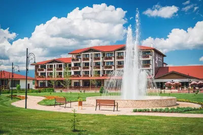 a large building with a fountain in front of a building at SPA Complex Belchin Spring in Belchin