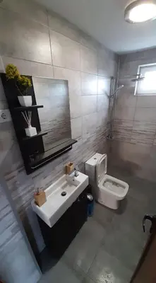 a bathroom with a sink and a toilet at Къща за гости Чечев in Sapareva Banya