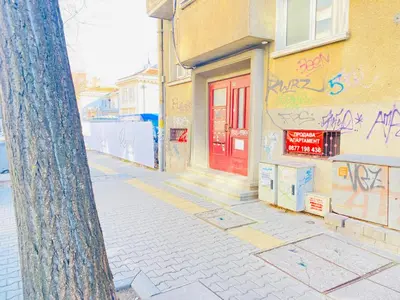 a building with graffiti on it with a red door at Beautiful Jewel in Top Center in Sofia