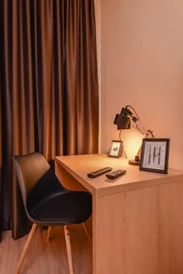 a desk with a chair and a lamp on it at Sofia Dream Apartment - The Library - 3-BDR, 2-BTHR by Flat Mаnager in Sofia