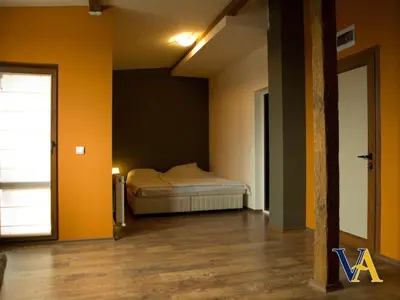 a bedroom with a bed in a room with yellow walls at Villa Aya in Smochevo