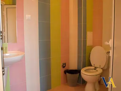 a bathroom with a toilet and a sink at Villa Aya in Smochevo
