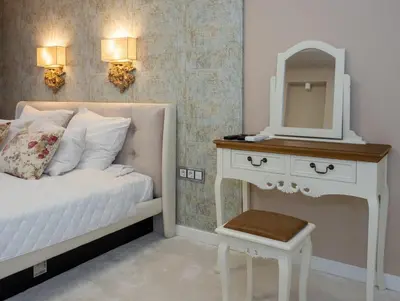 a bedroom with a white bed and a mirror at Paradise Center Premium Suite 1 in Sofia
