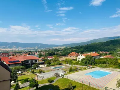 an aerial view of a town with a swimming pool at Апартамент за гости Dolce Vita in Gyurgevo