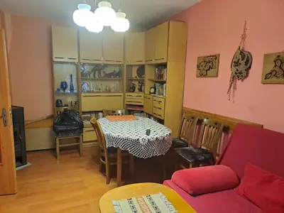 a living room with a table and a couch at Apartment Milevi in Teteven