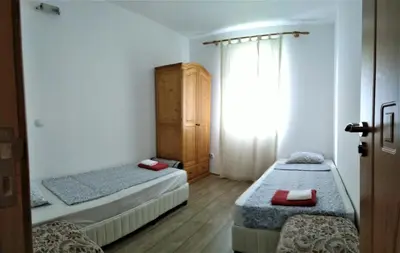 a bedroom with two beds and a window in it at VILLA IRINA - Govedartsi in Govedartsi