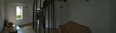 a living room with a staircase and a stair case at VILLA IRINA - Govedartsi in Govedartsi