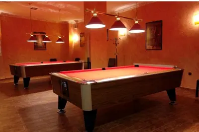 a billiard room with two pool tables in it at Private Apartment in Grand Monastery in Pamporovo