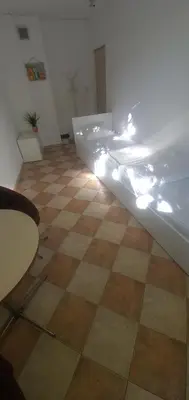 a room with a checkered floor and a bed with lights at ПАИ Хост in Plovdiv