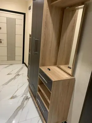 a kitchen with a closet with a refrigerator at Патилови in Sandanski