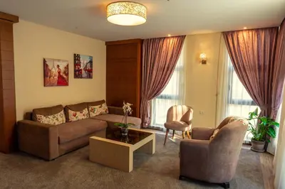 a living room with a couch and two chairs at Boutique hotel Provence Бутик хотел Прованс in Petrich