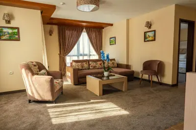 a living room with a couch and a table at Boutique hotel Provence Бутик хотел Прованс in Petrich