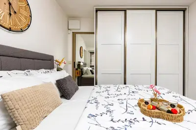 a bedroom with a bed with a basket of food on it at Stylish 1BD Flat with a terrace near the centre of Plovdiv by Flat Mаnager in Plovdiv