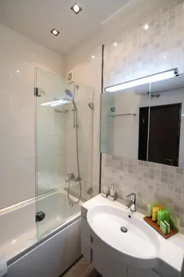 a bathroom with a sink and a glass shower at Lake View House in Bansko