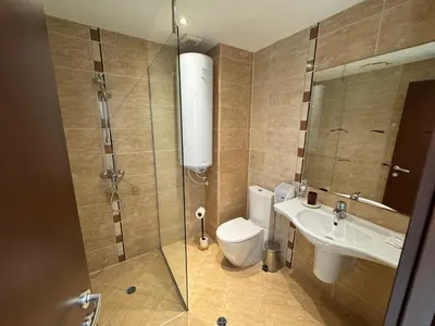 a bathroom with a toilet and a sink at Sunny Duplex, Mountain Views, Spa Access, Near Bansko, Terra Complex in Razlog