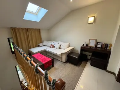 a living room with a couch and a table at Sunny Duplex, Mountain Views, Spa Access, Near Bansko, Terra Complex in Razlog