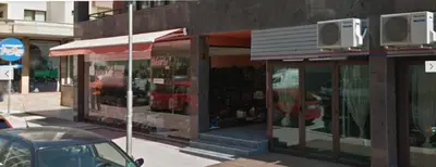 a store on the side of a city street at Апартамент Перла in Sandanski