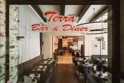 a restaurant with a sign that reads karma bar and diner at Apartments B06 in TERRA complex in Razlog