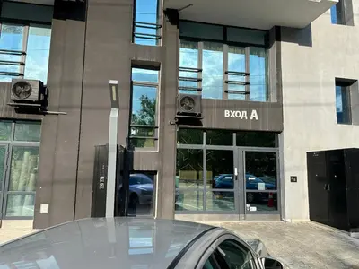 a car parked in front of a building at Boutique Magenta Gold Apartment in Sofia