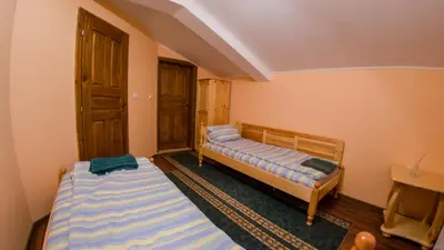 a bedroom with two beds in a room at Къща за гости Черна река in Ribarica