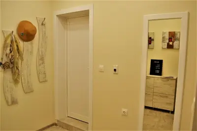 a hallway with a door to a room at Guest Apartment Balkan in Karlovo