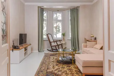 a living room with a couch and a table at Spacious vintage 2BR, 2bath apartment by Flat Mаnager in Sofia