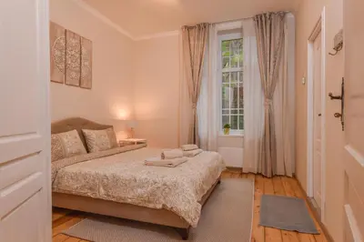 a bedroom with a bed and a window at Spacious vintage 2BR, 2bath apartment by Flat Mаnager in Sofia