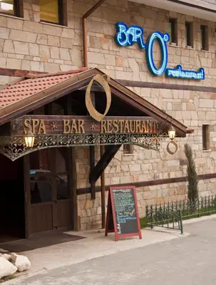 a bar with a sign in front of a building at Апартамент в комплекс Bansko Royal Towers in Bansko