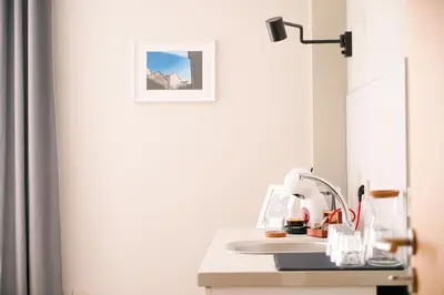 a white desk with a sink and a mirror at So Close Kapana - 2 Rooms Central Apartments in Plovdiv