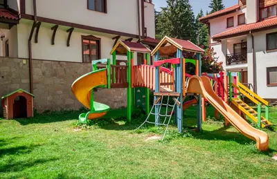 a playground with a slide in the grass at 