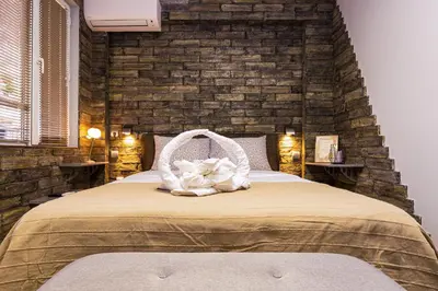 a bedroom with a bed with a basket on it at 1BD Apartment - 5 mins to the city centre by Flat Mаnager in Plovdiv