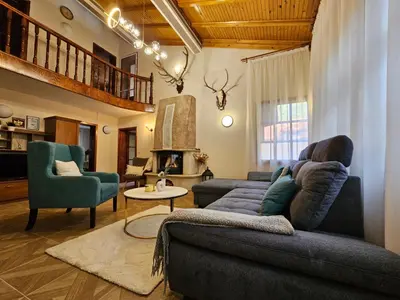 a living room with a couch and two chairs at Вила Пенчеви, кк. Цигов чарк in Tsigov Chark