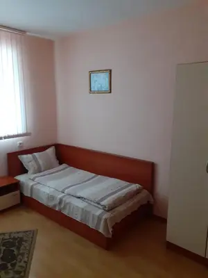 a small bedroom with a bed in a room at Хотелски Комплекс Авалон in Asenovgrad