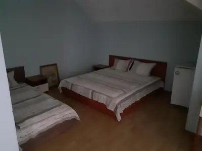 a bedroom with two beds in a room at Хотелски Комплекс Авалон in Asenovgrad