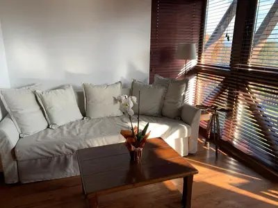 a living room with a couch and a coffee table at Katarino Mountain House in Razlog