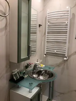 a bathroom with a sink and a mirror at Luxury Villa Borina in Zheleznitsa