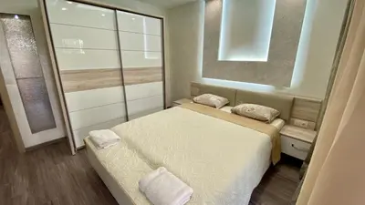 a small bedroom with a bed and a window at Paradise Swing Apartment Sofia in Sofia