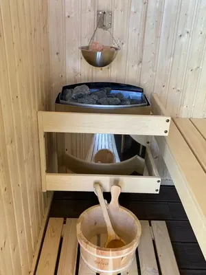 a sauna with a sink and a bowl in it at Villa Detelina in Sapareva Banya