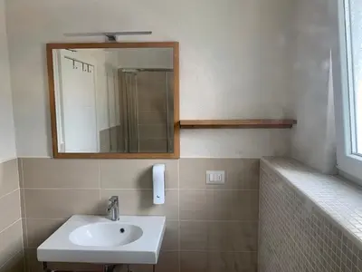 a bathroom with a sink and a mirror at Villa Detelina in Sapareva Banya