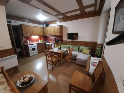 an overhead view of a living room and kitchen with a table at Private Studio Pirin Golf Hotel Bansko in Razlog