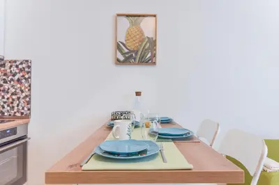 a dining room table with blue dishes on it at Cosy & renovated 2BD flat near Vitoshka by Flat Mаnager in Sofia
