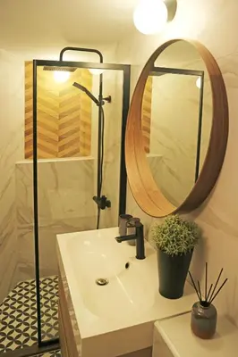 a bathroom with a sink and a mirror at Modern Cozy Apartment in Kyustendil