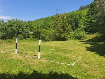 a soccer field with a goal in the grass at Nice bungalow in Petrich in Kamena