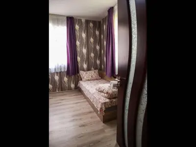 a small room with a bed and a window at Nice bungalow in Petrich in Kamena