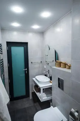 a bathroom with a toilet and a mirror at Borovete Mountain Luxury in Borovets