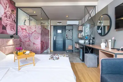 a living room with a couch and a table at Hotel Urban in Plovdiv