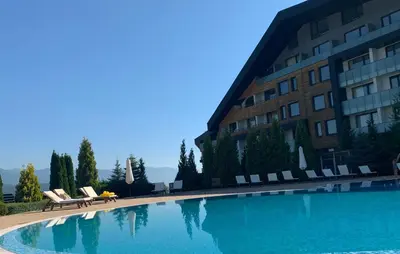 a large swimming pool in front of a building at Aspen heights studio 308 in Razlog