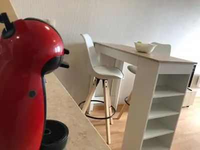 a red helmet sitting next to a table with a chair at Aspen heights studio 308 in Razlog
