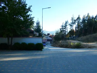 an empty street with a street light on the side of a road at Nikol Deluxe in Velingrad