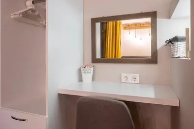 a bathroom with a white counter and a mirror at Central & Beautiful Apartment - Perfect Location by Flat Mаnager in Sofia